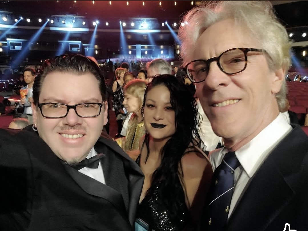 Jack Miele in a tuxedo selfie with two others at a formal event